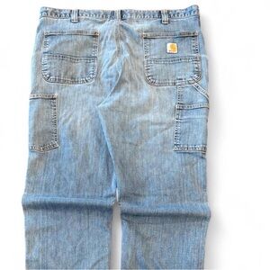 Vintage CARHARTT Distressed blue denim jeans with a baggy fit
38x32